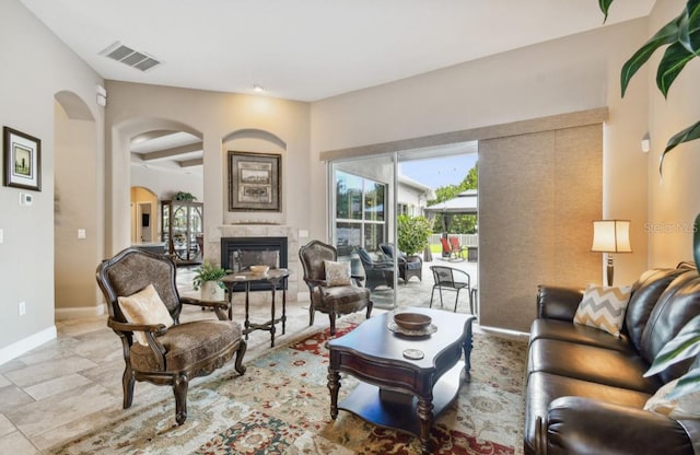 living room featuring a premium fireplace