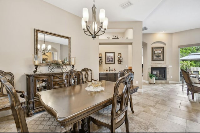 dining space featuring a notable chandelier