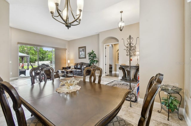 dining space with a chandelier