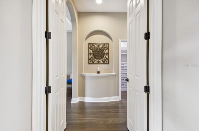 hall with dark hardwood / wood-style flooring