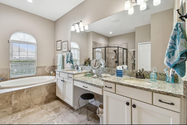 bathroom featuring vanity and plus walk in shower