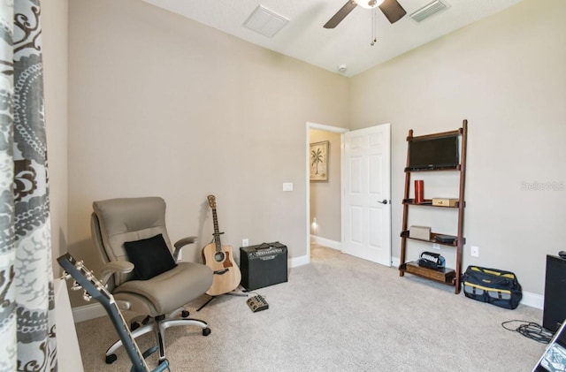 interior space featuring light colored carpet and ceiling fan