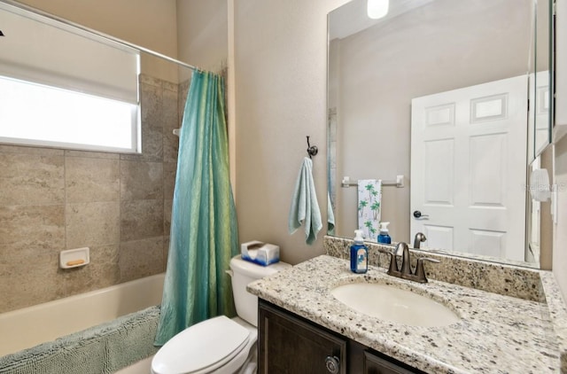 full bathroom featuring vanity, toilet, and shower / tub combo