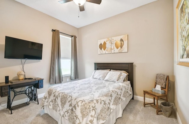 bedroom with light colored carpet and ceiling fan