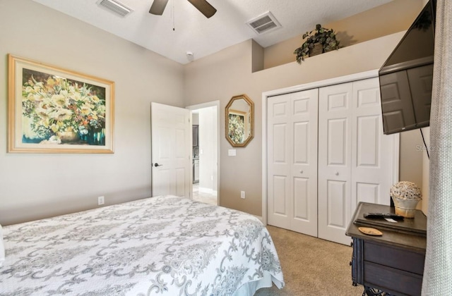 bedroom featuring ceiling fan, a closet, and carpet floors