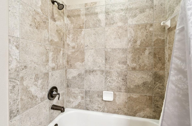 room details with shower / bath combo with shower curtain