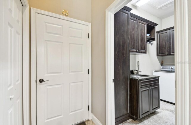 interior space with sink and washer / clothes dryer