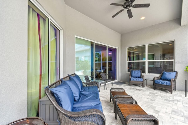 view of patio featuring ceiling fan and an outdoor living space