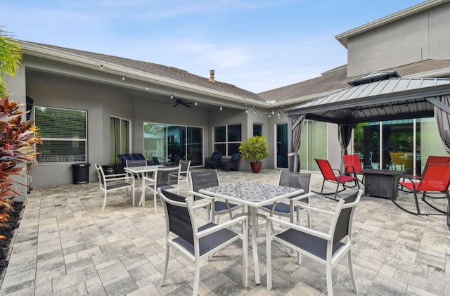 view of patio featuring ceiling fan