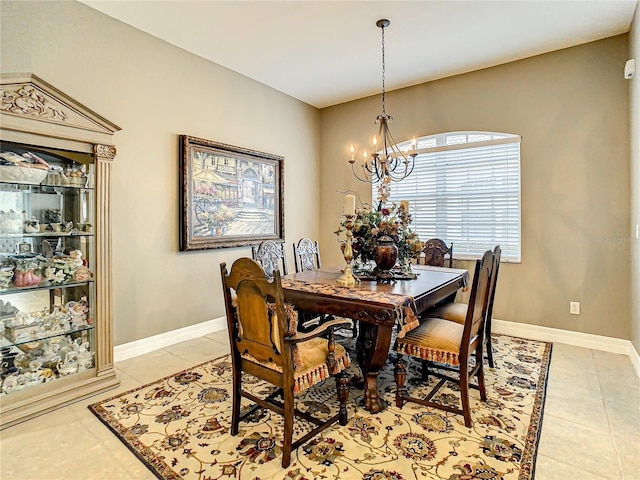 dining space with a chandelier and light tile patterned flooring