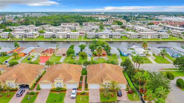 birds eye view of property featuring a water view