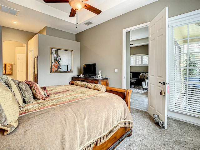 carpeted bedroom with ceiling fan