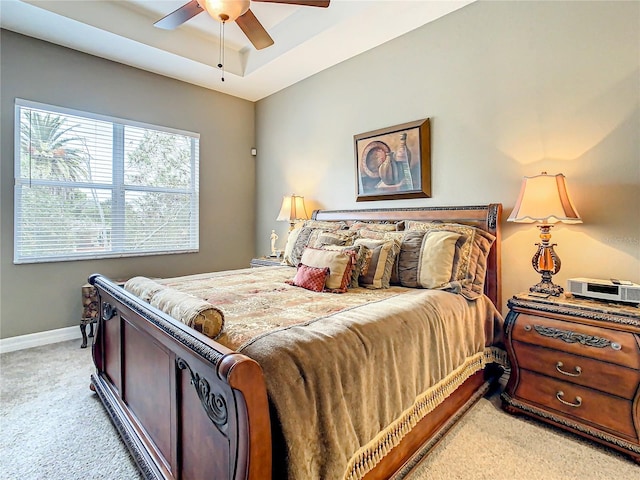 bedroom with ceiling fan and light carpet