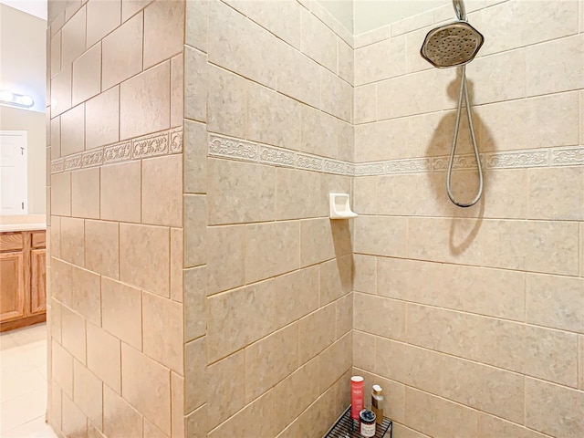 bathroom with vanity and tiled shower