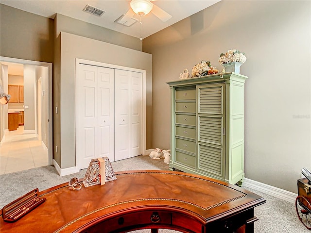 office space featuring ceiling fan and carpet floors