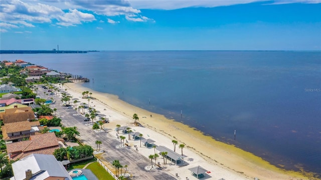 bird's eye view with a water view and a view of the beach