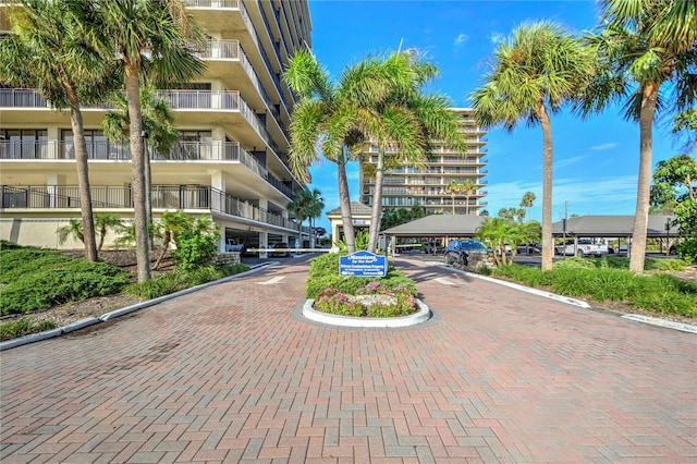 view of property's community featuring decorative driveway