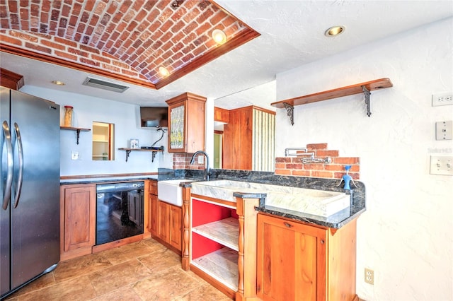 kitchen featuring brown cabinetry, freestanding refrigerator, dishwasher, and open shelves