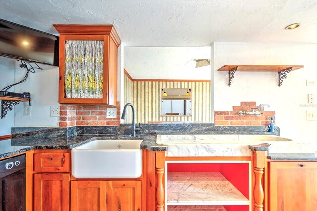 kitchen with a sink, a textured ceiling, dishwasher, and open shelves