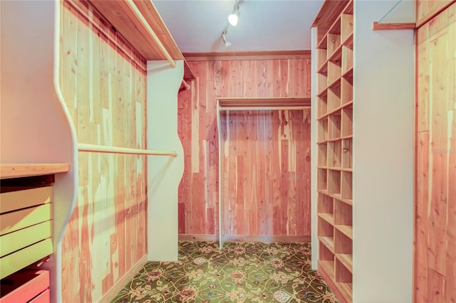 walk in closet with tile patterned floors