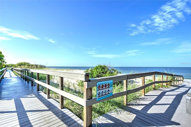 exterior space featuring a view of the beach and a water view