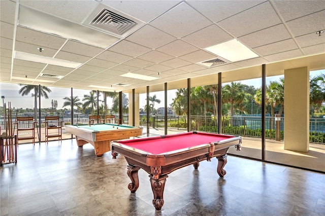 game room featuring a paneled ceiling, a wall of windows, visible vents, and tile patterned floors