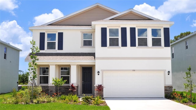 708 160th Ln E, Bradenton, FL 34212 - view of front of home with driveway, stone siding, and stucco siding