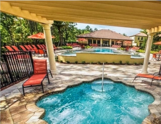 view of swimming pool with a patio