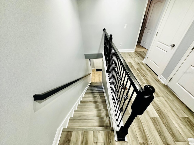 staircase featuring hardwood / wood-style floors