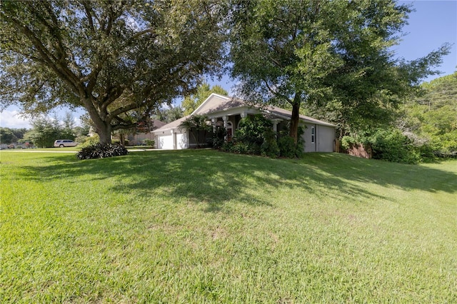 view of yard with an attached garage