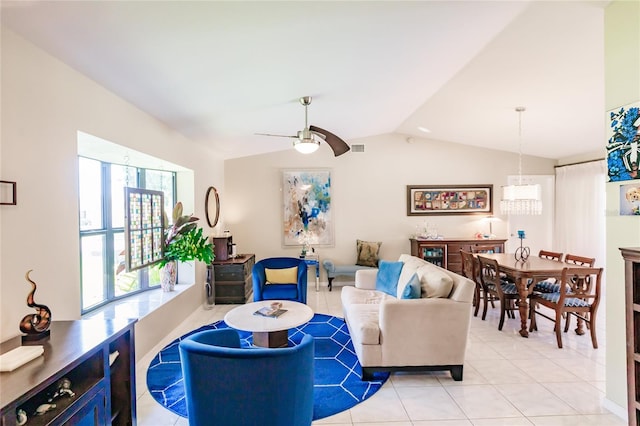 living room with lofted ceiling, ceiling fan, and light tile patterned floors