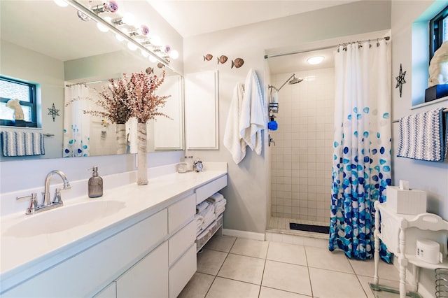 bathroom featuring tile patterned floors, a healthy amount of sunlight, vanity, and a shower with shower curtain