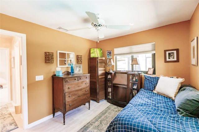 bedroom featuring ceiling fan and light hardwood / wood-style floors