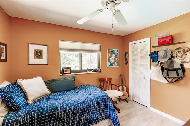 bedroom featuring a closet, ceiling fan, and light hardwood / wood-style floors