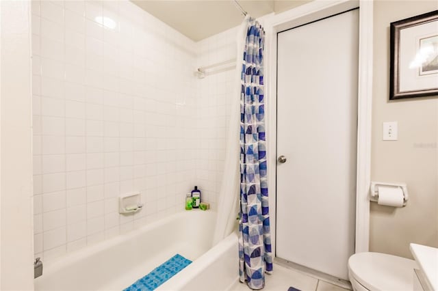 full bathroom with tile patterned floors, toilet, shower / tub combo with curtain, and vanity