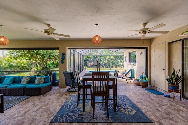 interior space with ceiling fan