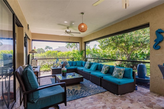 sunroom / solarium with ceiling fan