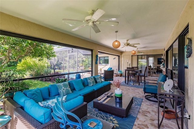 sunroom / solarium with ceiling fan