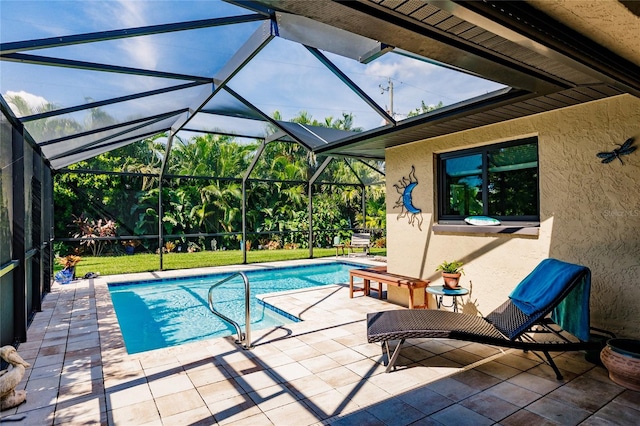 view of pool with a lanai and a patio