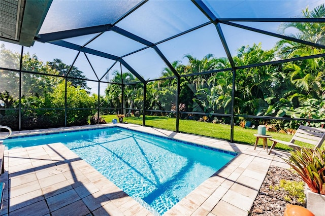 view of swimming pool with a patio and glass enclosure