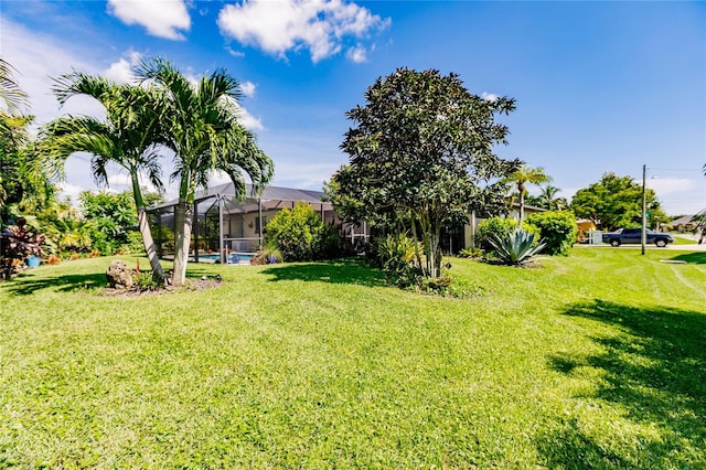 view of yard with a lanai