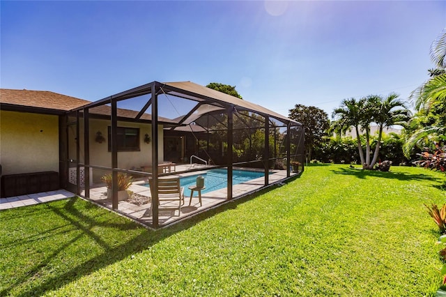 exterior space with a lawn, a lanai, and a patio area