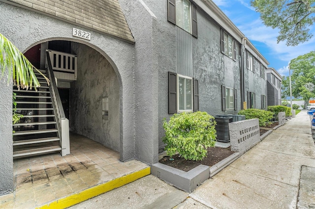 3822 Cortez Dr Unit D, Tampa, FL 33614 - property entrance featuring stucco siding and central AC