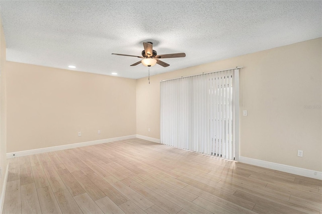 3822 Cortez Dr Unit D, Tampa, FL 33614 - spare room featuring a ceiling fan, light wood finished floors, baseboards, a textured ceiling, and recessed lighting