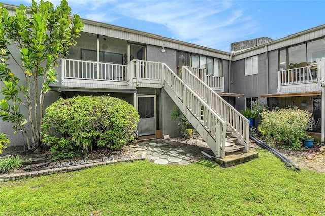 3822 Cortez Dr Unit D, Tampa, FL 33614 - back of property with a lawn and stairs