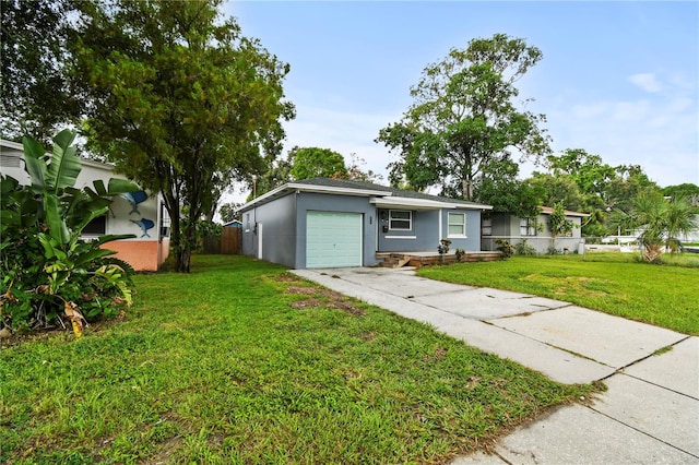 ranch-style house featuring an attached garage, fence, concrete driveway, stucco siding, and a front yard