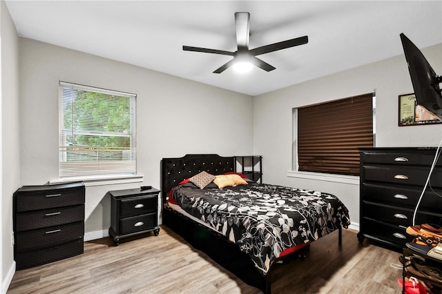 bedroom featuring ceiling fan and light wood-type flooring