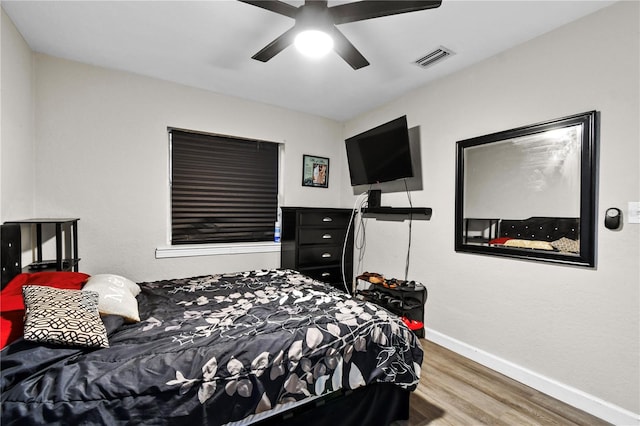 bedroom featuring ceiling fan and hardwood / wood-style flooring