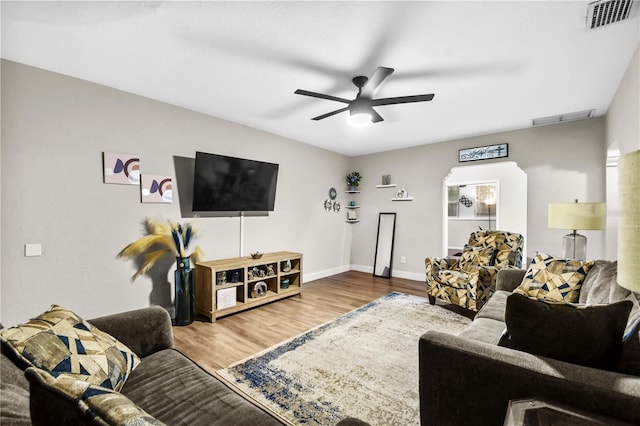 living room with hardwood / wood-style floors and ceiling fan