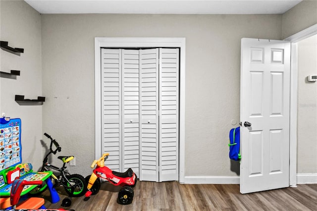 game room with hardwood / wood-style floors